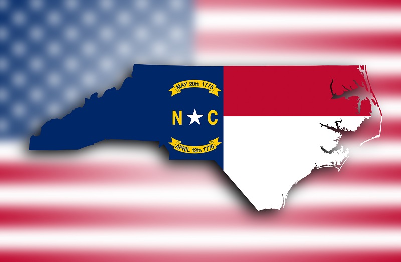 a map of north carolina with a flag in the background.