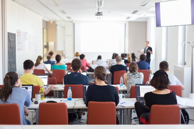 a group of people in a classroom.