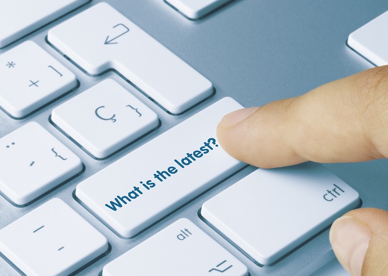 a finger pressing a keyboard key.