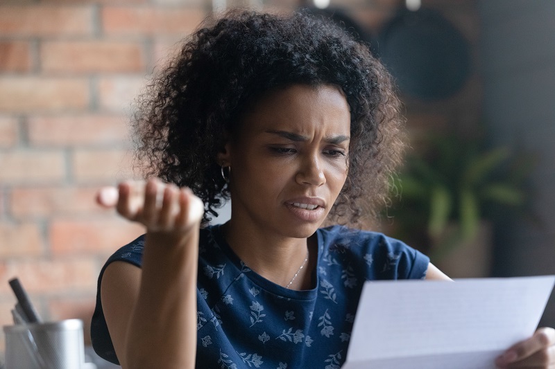 a person looking at a piece of paper.