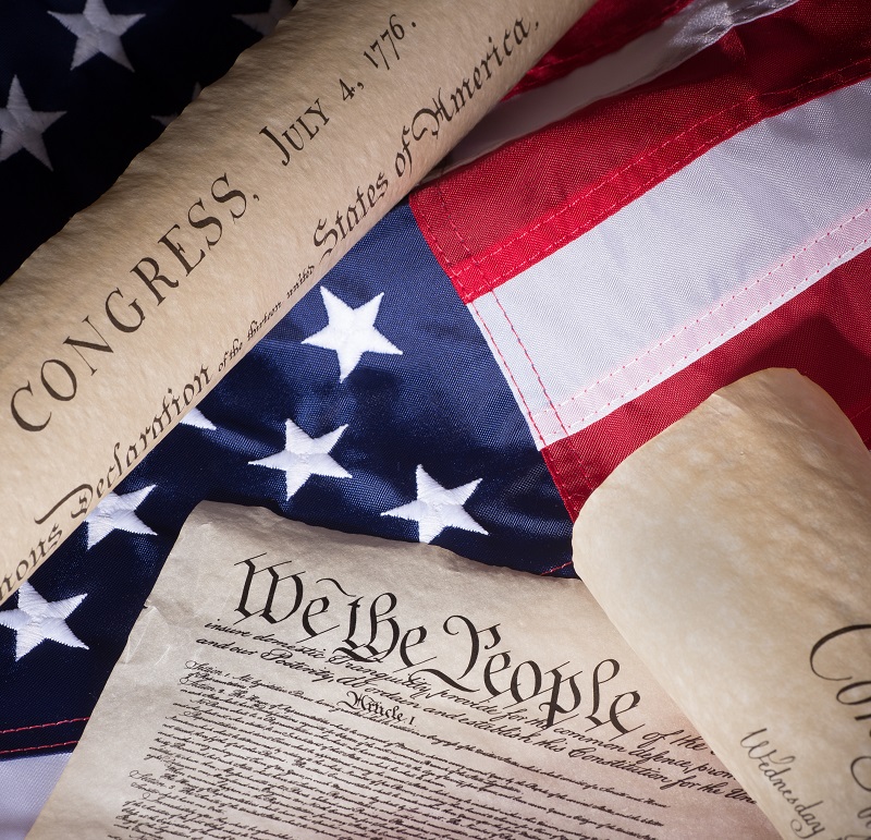 a close up of several rolled up papers on a flag.