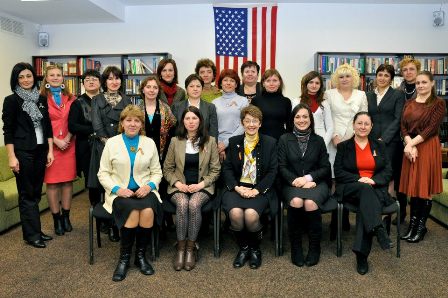 a group of women posing for a photo.