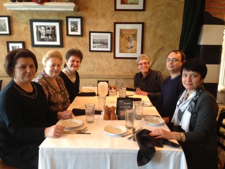 a group of people sitting at a table.