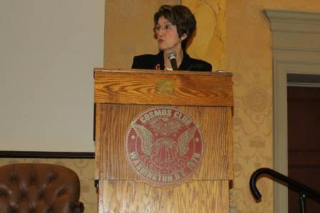 a person speaking at a podium.