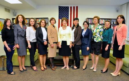 a group of women standing in a room.