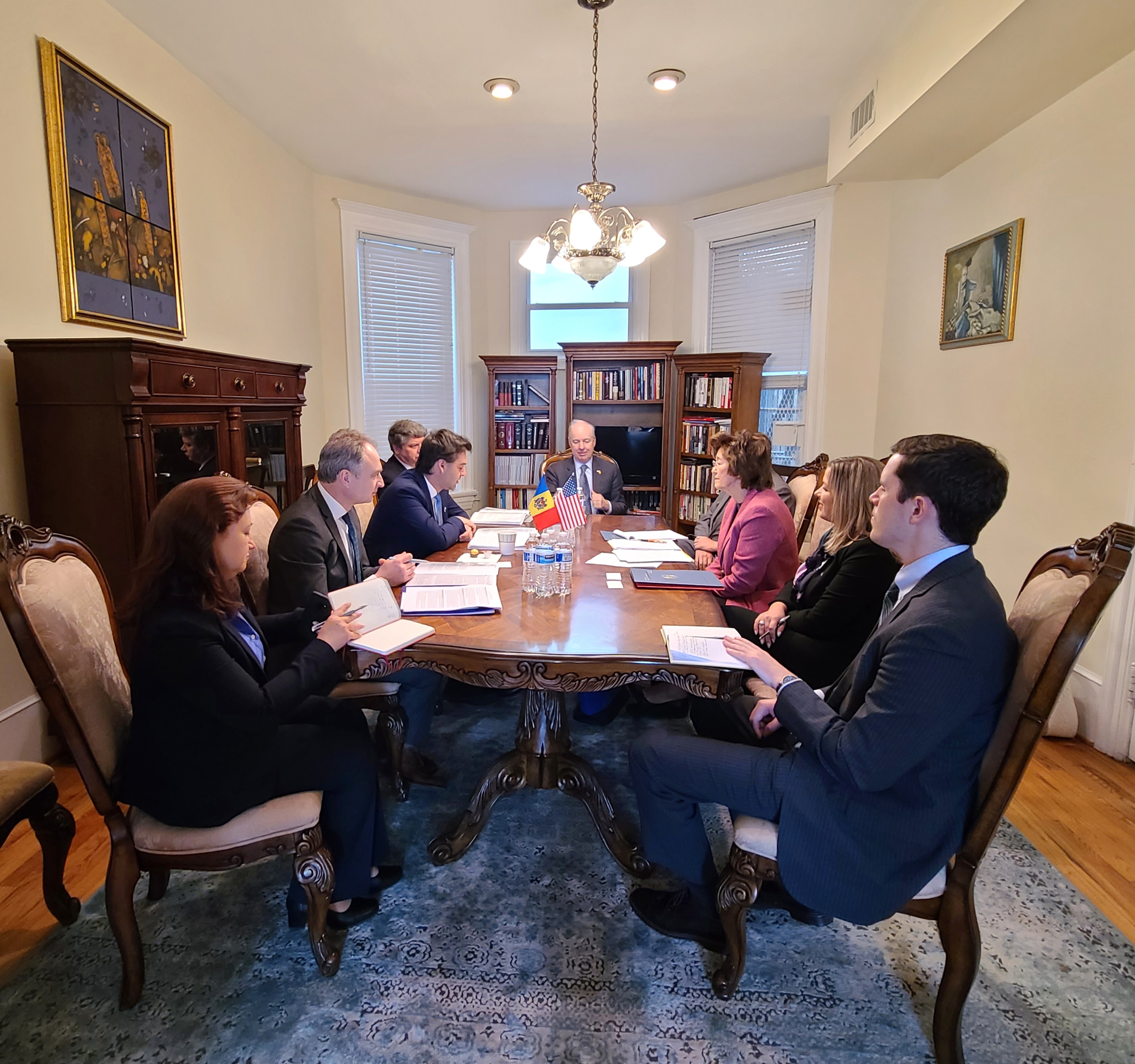 a group of people around a table.