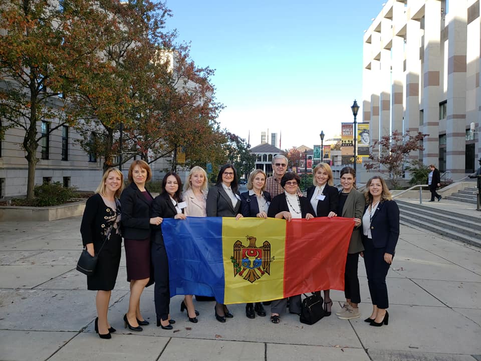 a group of people holding a flag.